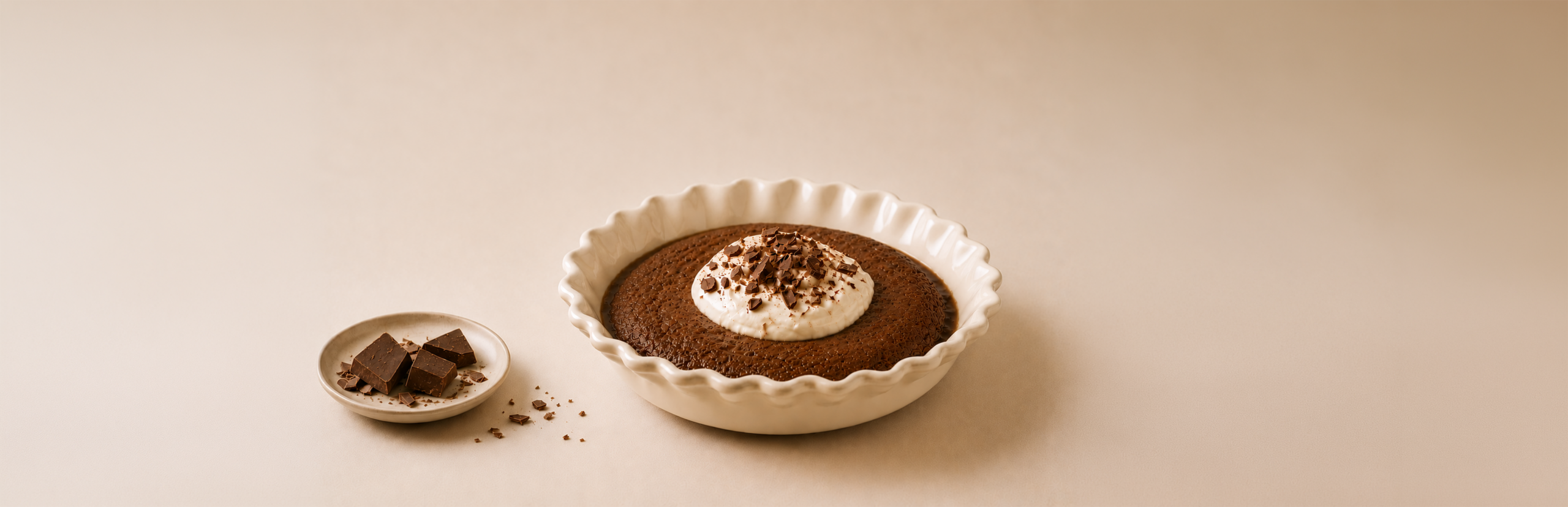 Salted caramel pudding with cream and chocolate