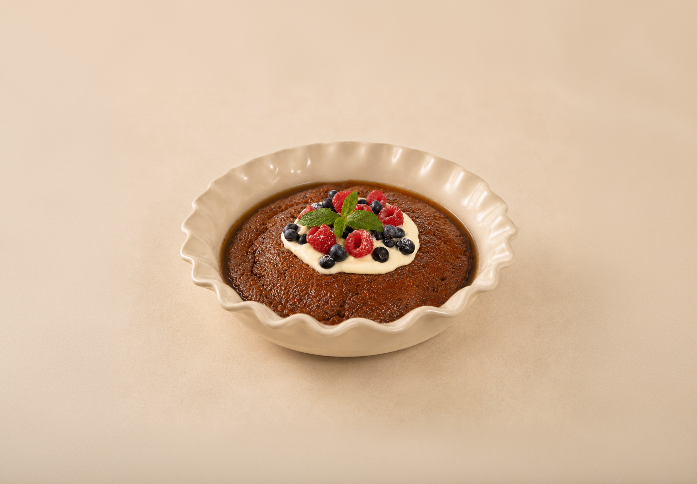 BAK caramel pudding in a ceramic serving dish