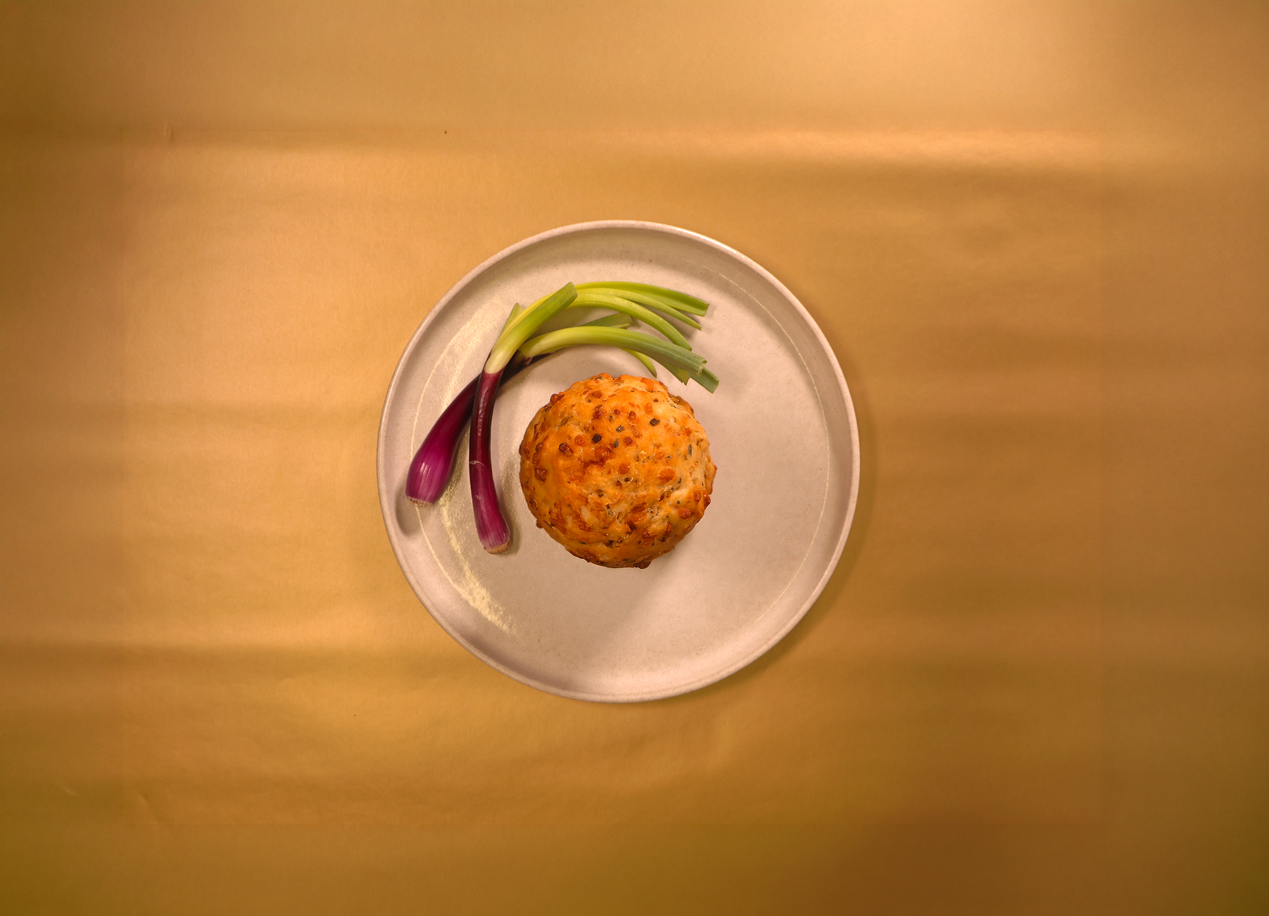 Overhead view of a savoury bake with spring onions